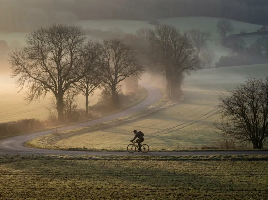 Cycling on an open road in the early morning